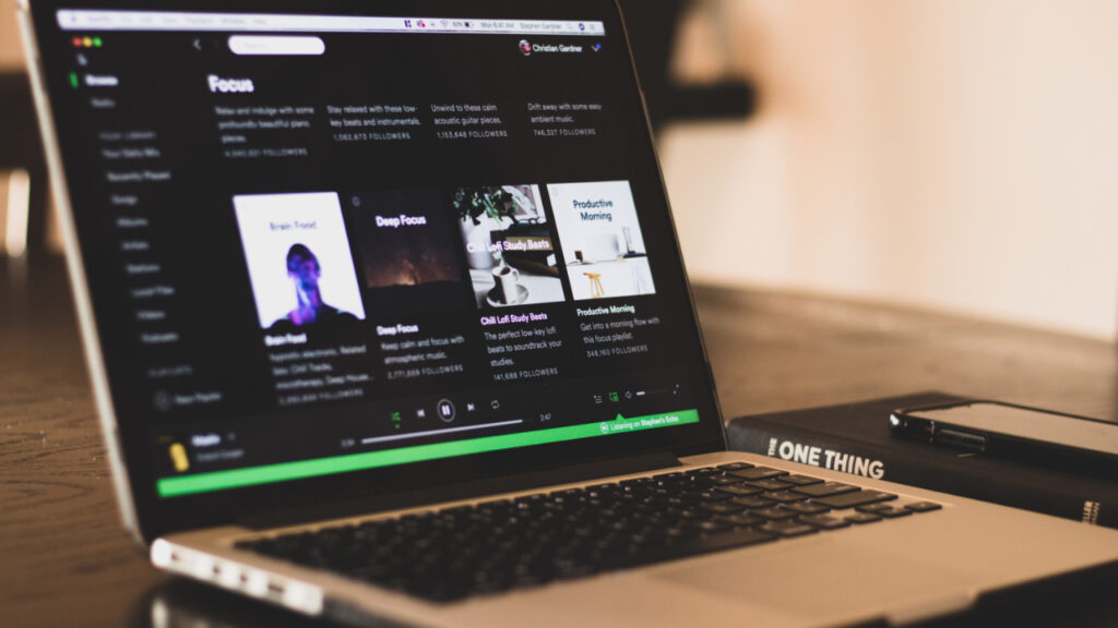 A laptop with the Spotify website open.