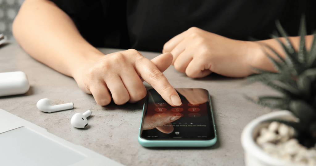 A person is unlocking her iPhone device.