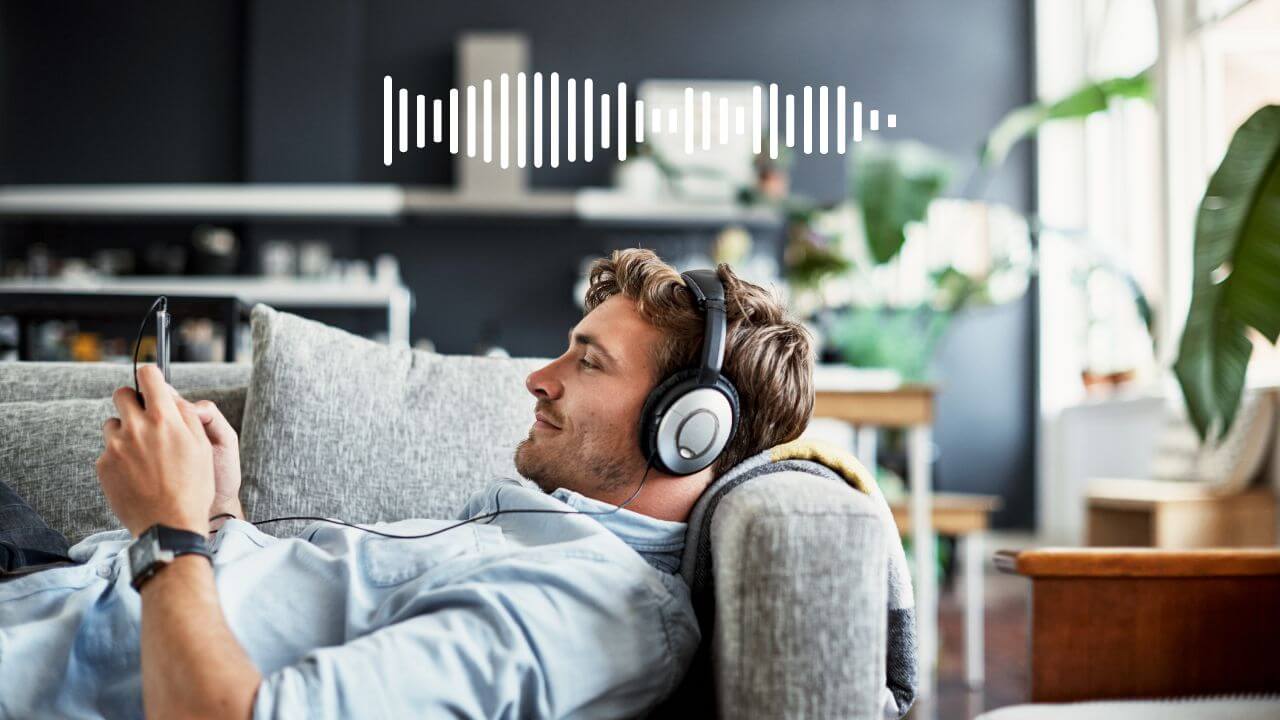 Lossy vs Lossless Audio: a man with headphones listening to music