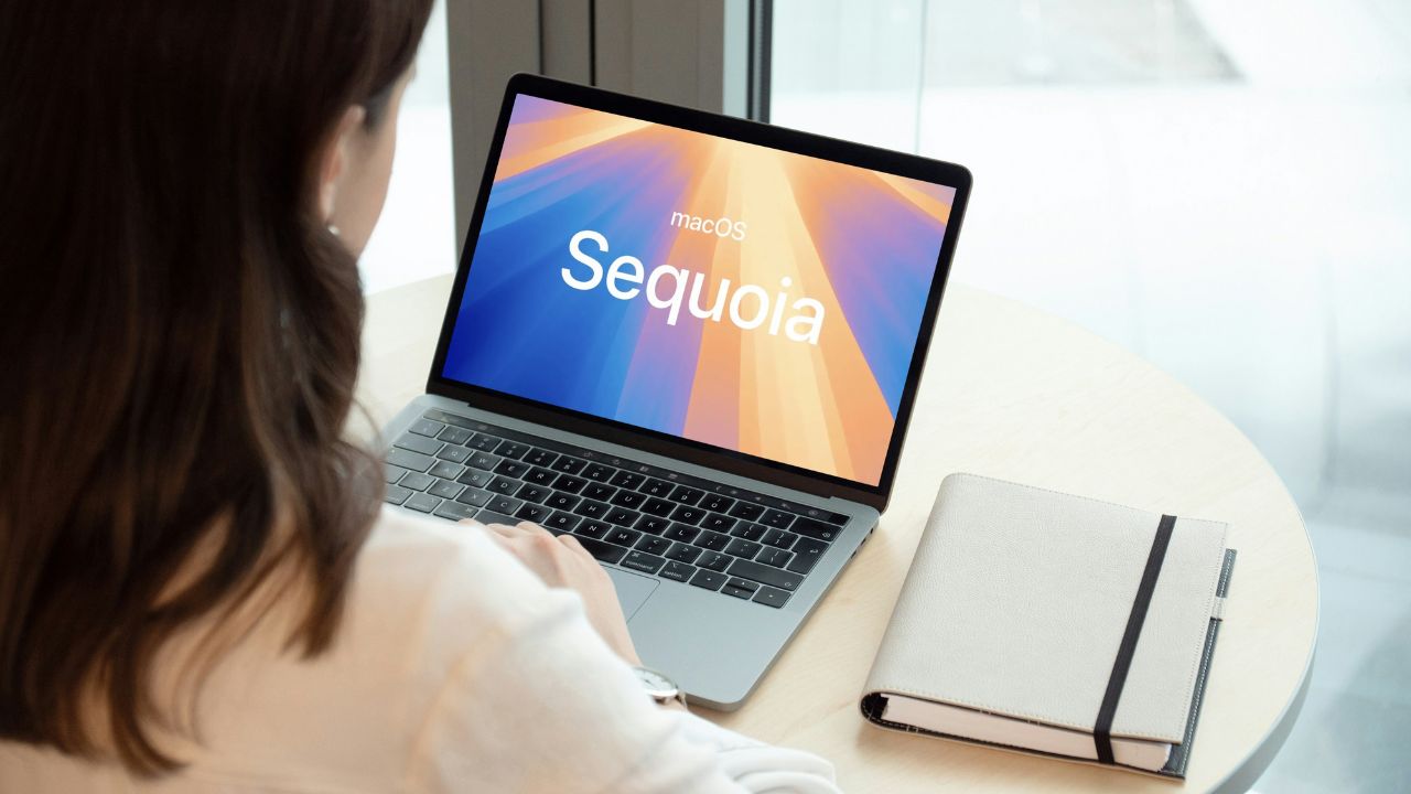 a woman using macOS Sequoia on her laptop